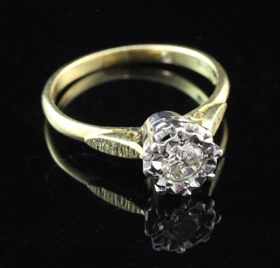 An 18ct gold and illusion set solitaire diamond ring, size P.